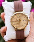 Gold Dial Watch with Brown Leather Strap and Date Display