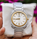 Silver Stainless Steel Watch with White Dial and Gold Accent Bezel
